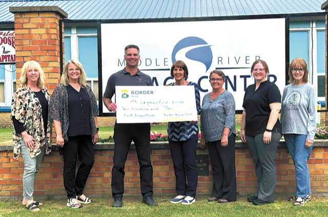 Middle River Community Club with the amazing grant check to benefit the community playgrounds and parks.