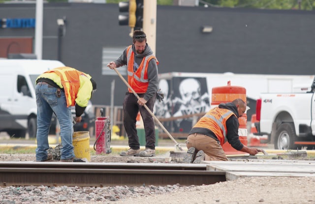 Crews busy at work on the railroad crossing at 2nd Ave NE, EGF